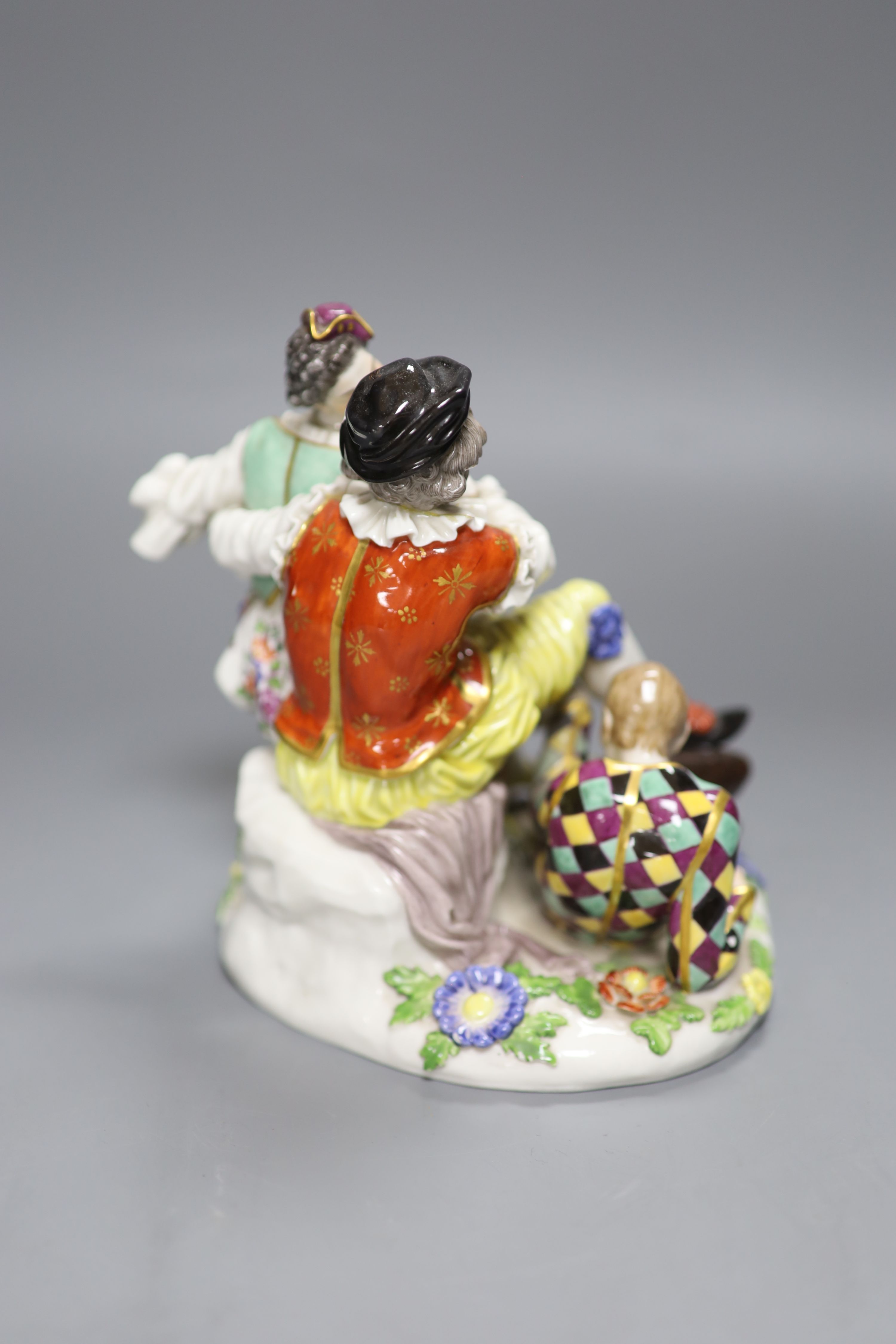 A Meissen porcelain group, The Indiscreet Harlequin, 19th century, height 16cm (a.f.)